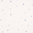 Calisto wallpaper in Ivory & Cobalt by Schumacher, featuring a playful scattered star motif in blue on an ivory background.