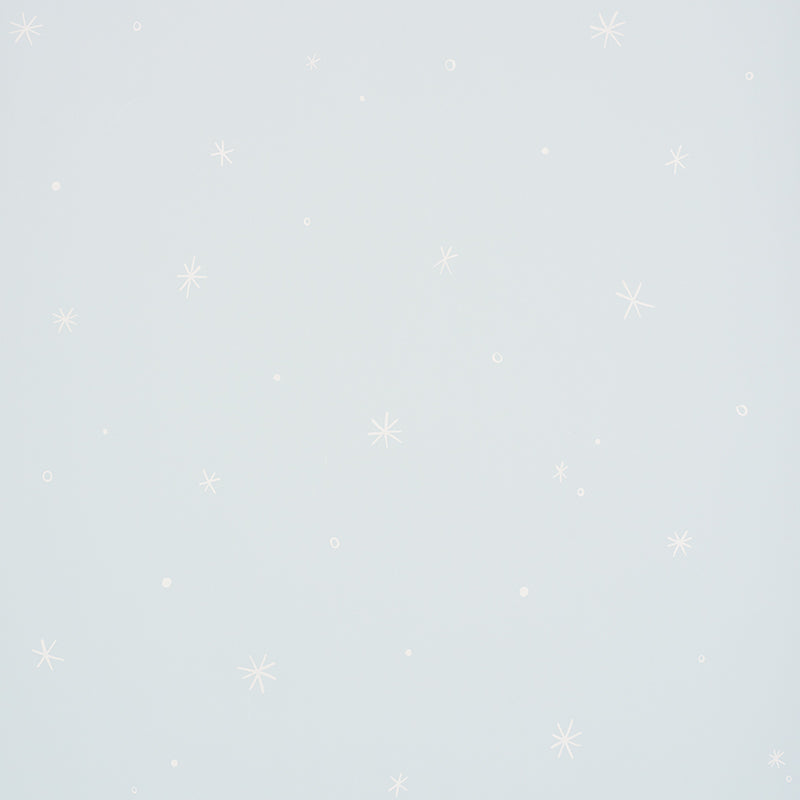 Calisto Mineral wallpaper by Schumacher featuring a subtle star and dot pattern on a pale blue background.