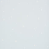 Calisto Mineral wallpaper by Schumacher featuring a subtle star and dot pattern on a pale blue background.