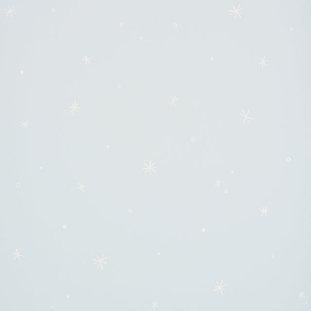 Calisto Mineral wallpaper by Schumacher featuring a subtle star and dot pattern on a pale blue background.