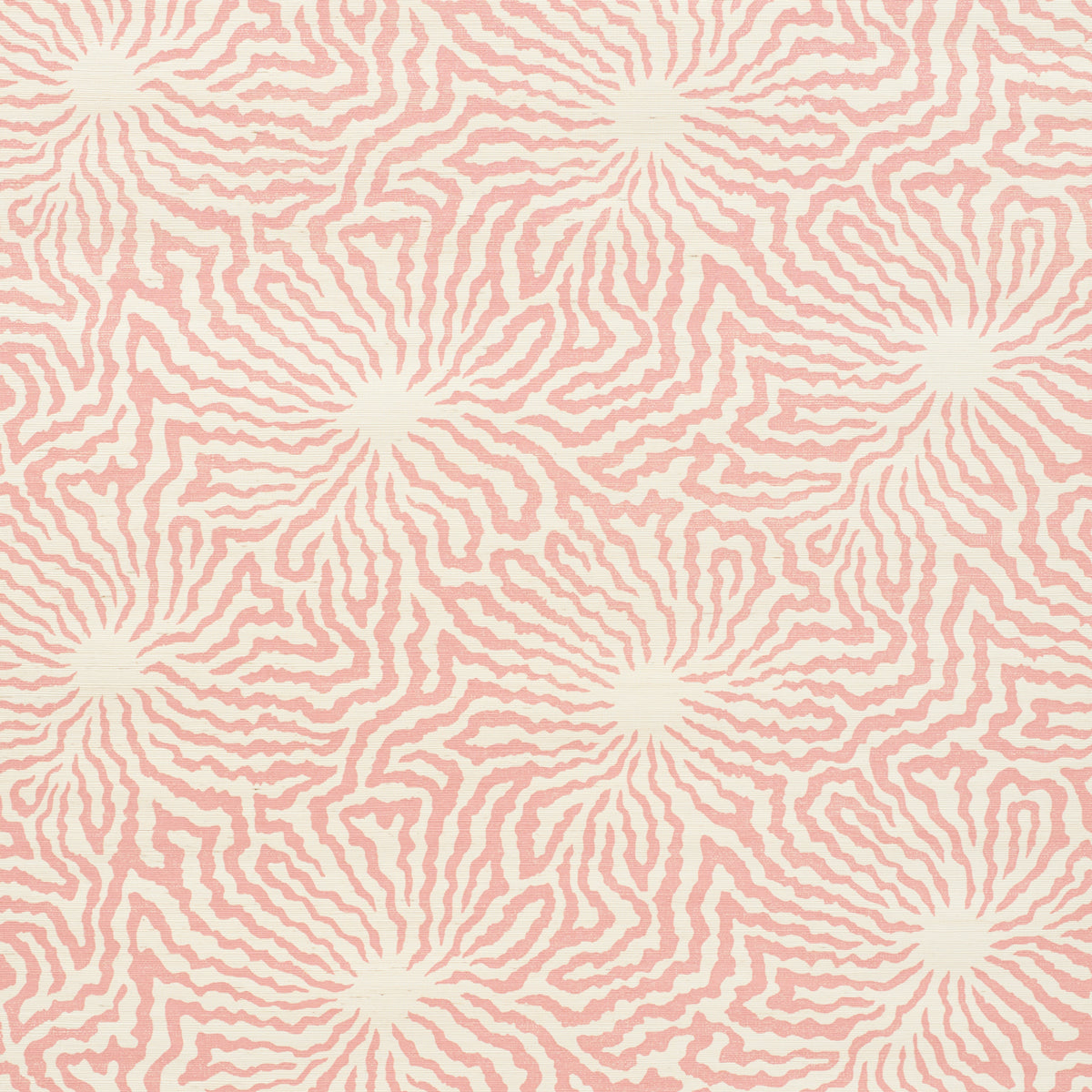 Flower Shock Sisal wallpaper in Peony by Celerie Kemble for Schumacher. Abstract floral pattern in pink on woven grasscloth ground.