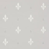 Grey wallpaper with a classic white fleur de lis pattern by Schumacher, shown both as a close-up and installed in a traditional room.