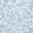Chrysanthemum Chambray blue floral wallpaper by Schumacher, shown in close-up and installed in a bedroom setting.
