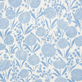 Chrysanthemum Chambray blue floral wallpaper by Schumacher, shown in close-up and installed in a bedroom setting.