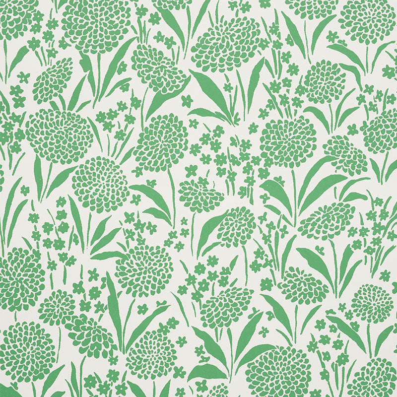 Chrysanthemum green floral wallpaper by Schumacher, shown in a bedroom setting and as a close-up pattern.