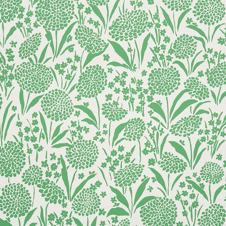 Chrysanthemum green floral wallpaper by Schumacher, shown in a bedroom setting and as a close-up pattern.
