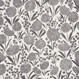 Chrysanthemum Carbon by Schumacher - Small floral print wallpaper in black and white, styled in a bathroom and bedroom setting.