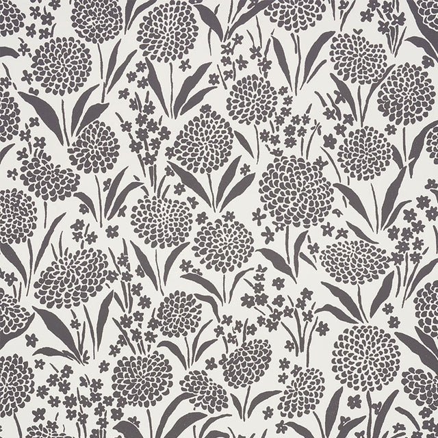 Chrysanthemum Carbon by Schumacher - Small floral print wallpaper in black and white, styled in a bathroom and bedroom setting.