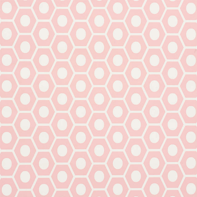 QUEEN B geometric pink and white hexagon wallpaper by Schumacher, shown in a styled interior and close-up pattern view.