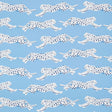 Leaping Leopards wallpaper in Sky by Schumacher features rows of sleek, spotted leopards on a blue background, perfect for adding a lively, chic touch to any room.
