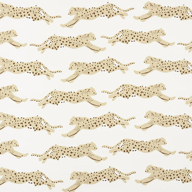 Leaping Leopards Sand wallpaper by Schumacher featuring rows of stylized leopards in motion on a neutral background.