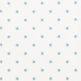 Stargaze blue star pattern wallpaper by Schumacher shown in a bedroom and study setting