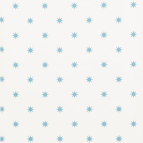 Stargaze blue star pattern wallpaper by Schumacher shown in a bedroom and study setting