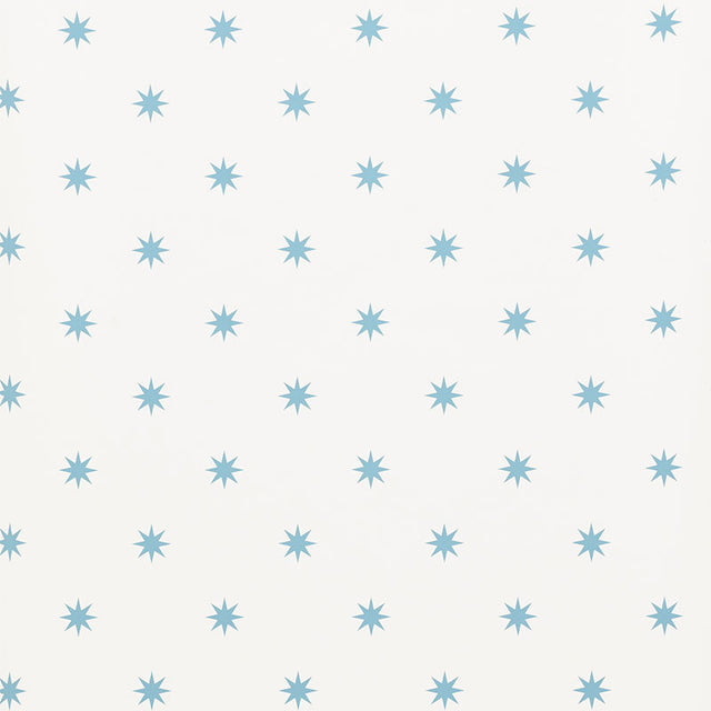 Stargaze blue star pattern wallpaper by Schumacher shown in a bedroom and study setting