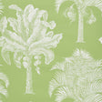 Grand Palms wallpaper in Leaf by Schumacher features a large-scale white palm silhouette print on a green background, shown in a styled interior and close-up.