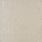 Moire wallcovering in parchment colorway with a watery, irregular appearance and delicate faille weave, by Schumacher.