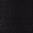 Moire Noir wallcovering with a watery, irregular moiré pattern and delicate faille weave, shown in a modern interior setting.
