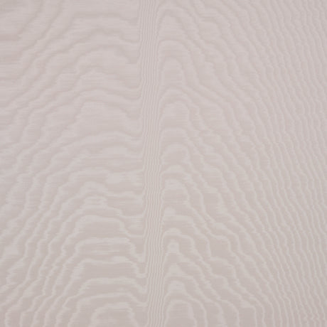 Moire wallcovering in Dove by Schumacher, featuring a watery, irregular moiré pattern with a delicate faille weave in a soft neutral shade, installed in a modern bedroom.