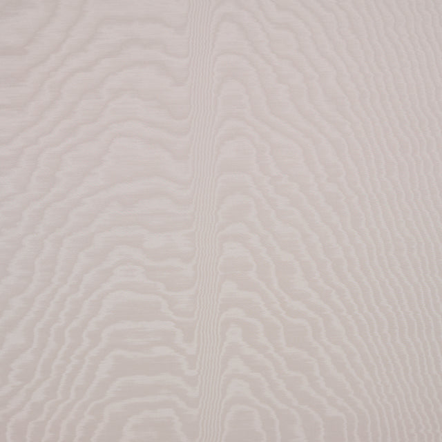 Moire wallcovering in Dove by Schumacher, featuring a watery, irregular moiré pattern with a delicate faille weave in a soft neutral shade, installed in a modern bedroom.