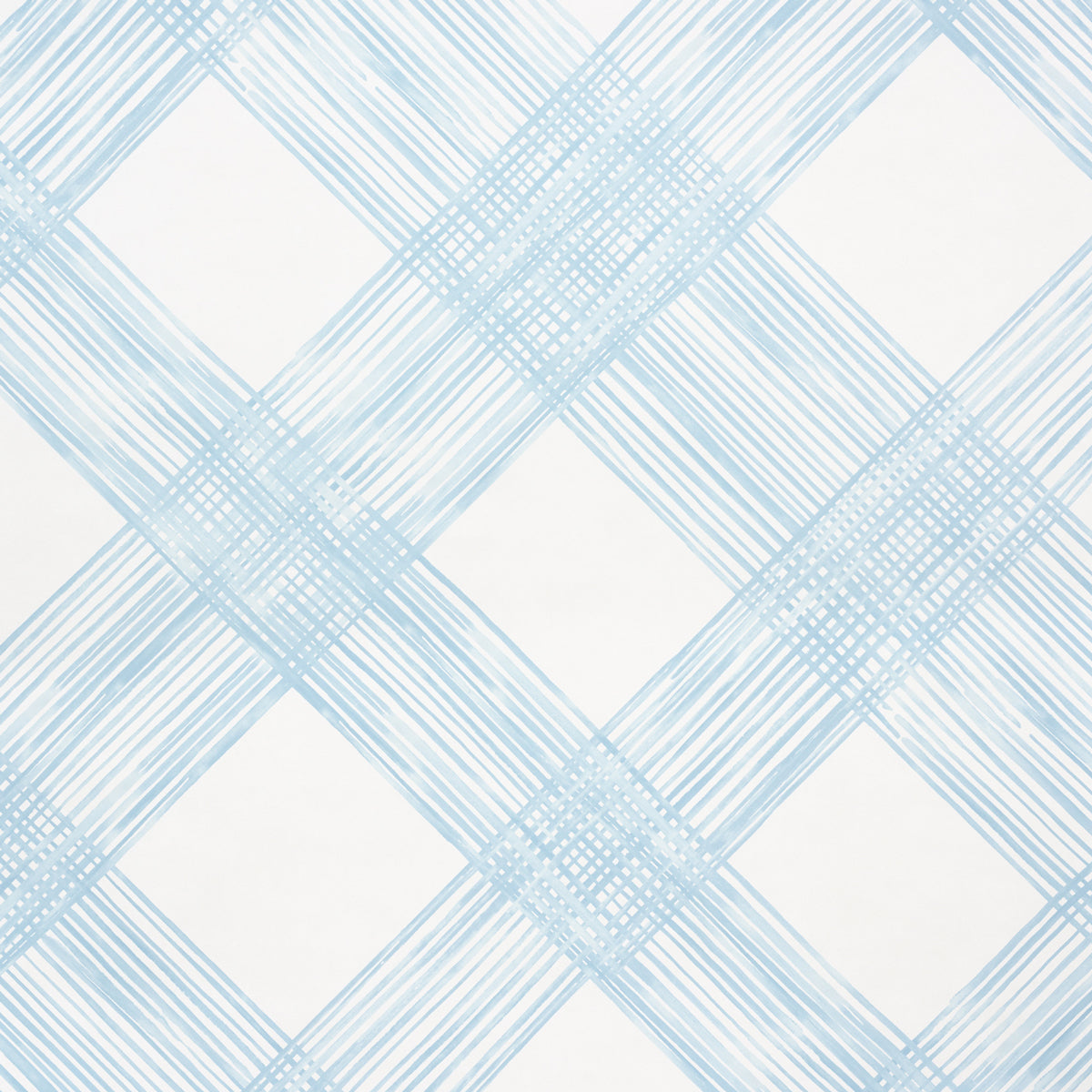 Traverse Sky by Porter Teleo for Schumacher. Large-scale hand-painted trellis pattern in blue on white non-woven wallpaper.