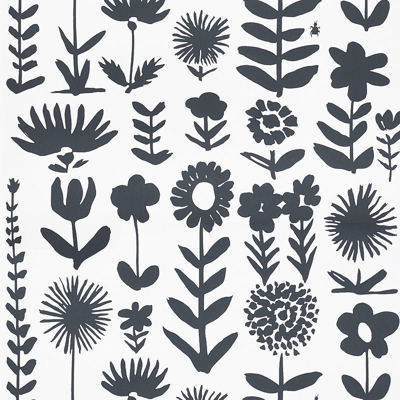 Wild Things wallpaper by Vera Neumann for Schumacher, featuring bold black stylized flowers on a white background.