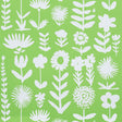 Wild Things wallpaper in Leaf by Vera Neumann for Schumacher, featuring stylized white flowers on a vibrant green background.