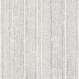 Mohave Carbon by Schumacher - Delicate handblocked stripe wallpaper in black and white, shown in a modern bedroom setting.