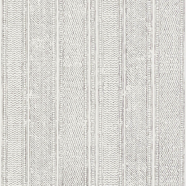 Mohave Carbon by Schumacher - Delicate handblocked stripe wallpaper in black and white, shown in a modern bedroom setting.