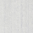 Mohave Indigo by Schumacher - Artisanal handblocked stripe wallpaper in blue and white, shown in a modern bedroom setting.