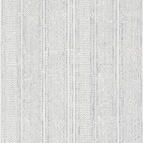 Mohave Indigo by Schumacher - Artisanal handblocked stripe wallpaper in blue and white, shown in a modern bedroom setting.