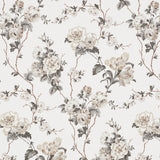 BETTY wallpaper in Charcoal by Veere Grenney for Schumacher, featuring a lush tangle of tulips, roses, and ranunculi climbing a trellis of branches.