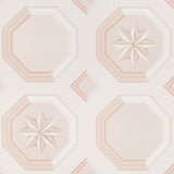 Augustus Blush wallpaper by Schumacher featuring an octagonal grid with faceted stars and floral medallions in a trompe l'oeil style.