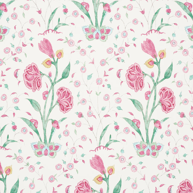 Khilana Floral wallpaper in pink with stylized Indian-inspired floral motifs by Schumacher, shown in a bedroom setting.