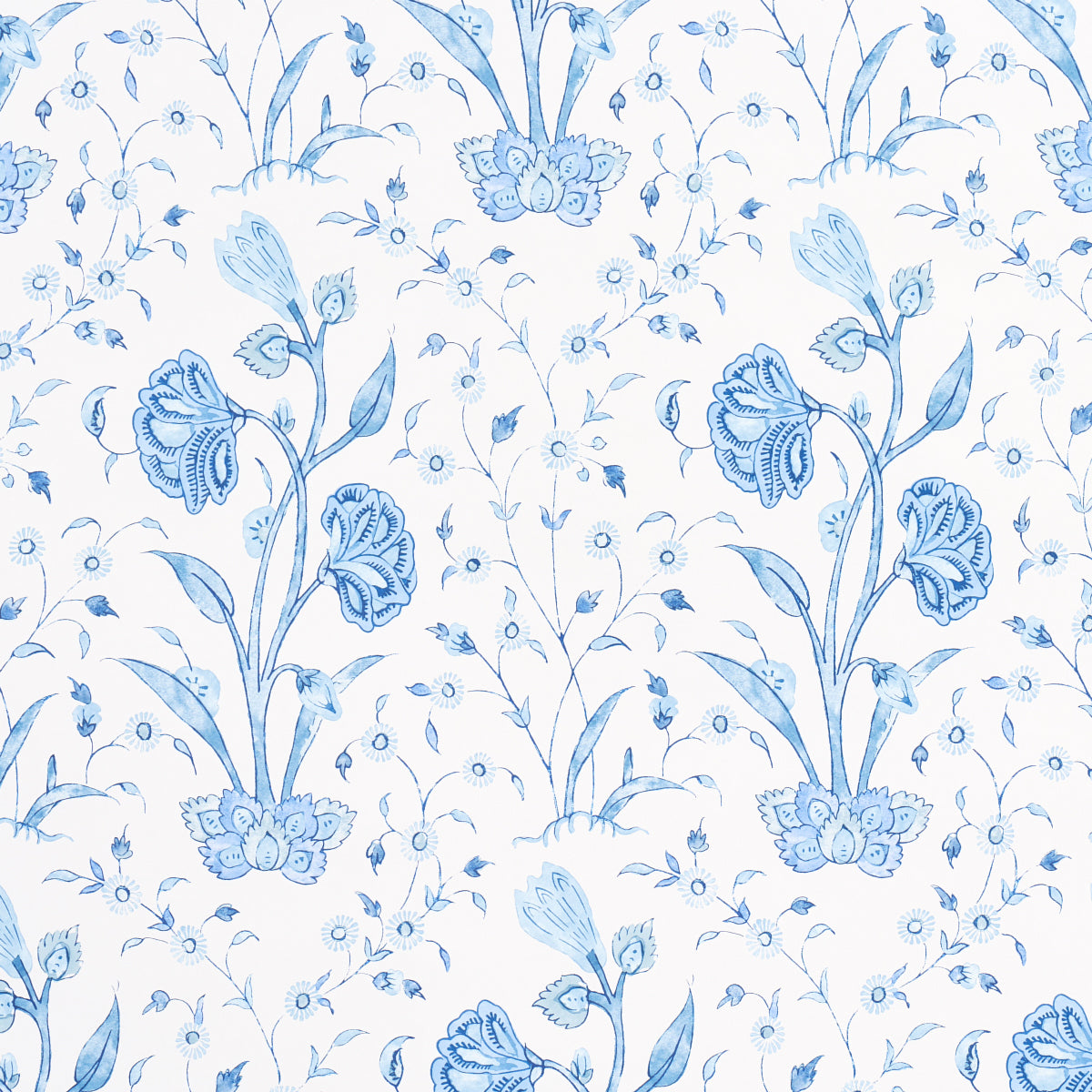 Khilana Floral Porcelain wallpaper by Schumacher, a large-scale blue and white floral pattern inspired by traditional Indian motifs.