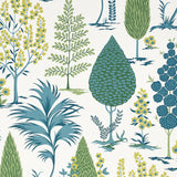 Pandora Peacock wallpaper by Schumacher features a whimsical grove of stylized trees in blue, green, and yellow on a white background.