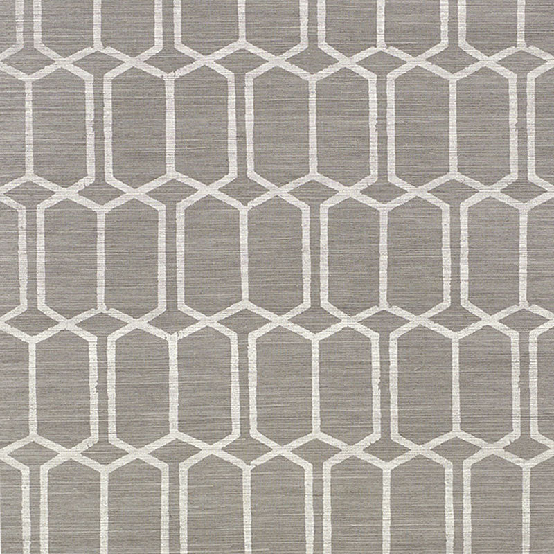 Modern Trellis Sisal wallpaper in charcoal by Schumacher, featuring a handprinted geometric trellis pattern on textured sisal.