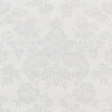 Simone Damask Grasscloth wallpaper in silver, featuring a classic damask pattern printed on textured grasscloth, styled in a modern bedroom setting.