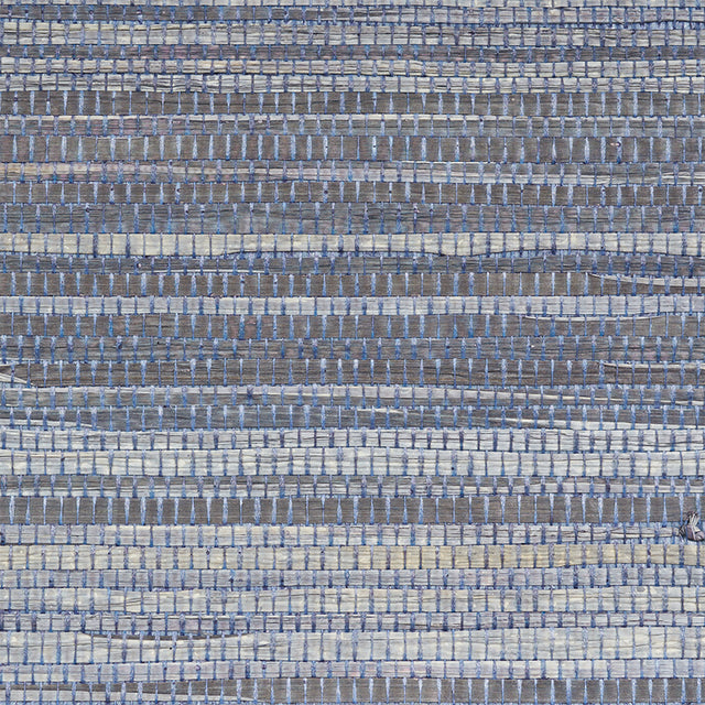 Dyed Raffia Slate textured woven wallcovering by Schumacher, showing irregular horizontal stripes and natural raffia fibers.