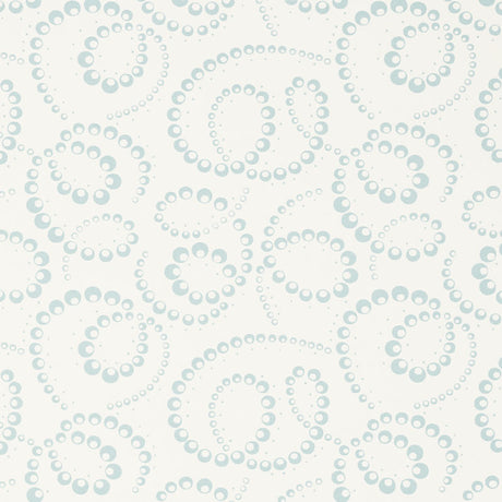 DORIAN wallpaper in Sky by Schumacher features abstracted botanical swirls in a soft blue on white background, shown in a modern bedroom setting.