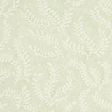 Etched Fern Leaf wallpaper in a soft green leaf colorway with a delicate fern motif, shown in a styled bedroom setting.
