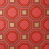 HANOVER Ruby geometric lattice wallpaper by Schumacher, bold red and gold octagonal and square pattern, surface-printed for rich depth.