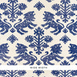 Regalia Sisal wallpaper in blue, featuring mirrored lions and stylized flowers on a textured grasscloth background.