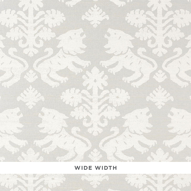 Regalia Sisal wallpaper in ivory on silver, featuring mirrored lions and stylized flowers on textured grasscloth by Schumacher.