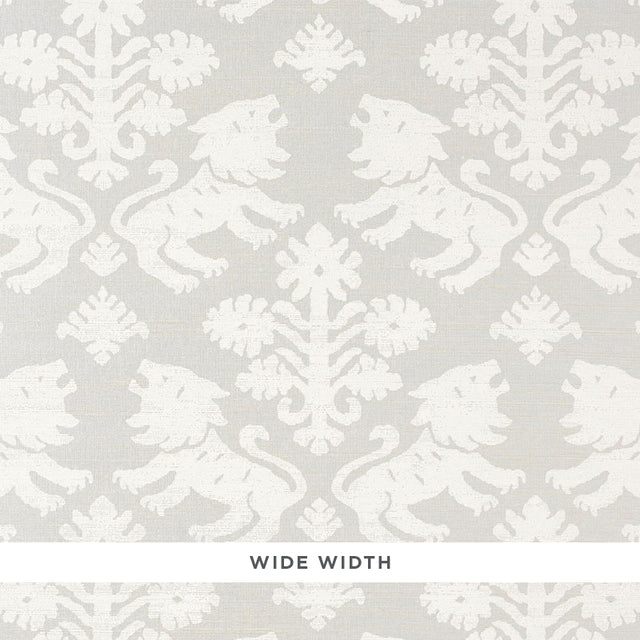 Regalia Sisal wallpaper in ivory on silver, featuring mirrored lions and stylized flowers on textured grasscloth by Schumacher.