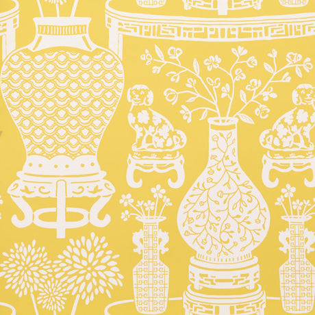 Yellow chinoiserie wallpaper featuring Ming vases, Staffordshire dogs, and floral motifs in a mirrored repeat by Schumacher.