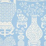 Hellene wallpaper in Sky by Schumacher featuring Ming vases and Staffordshire dogs in a mirrored pattern on a blue background.