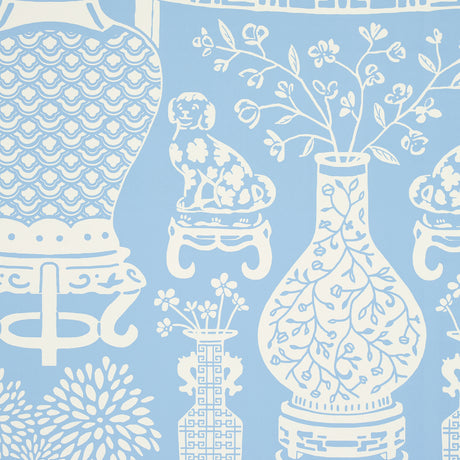 Hellene wallpaper in Sky by Schumacher featuring Ming vases and Staffordshire dogs in a mirrored pattern on a blue background.