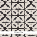 Andromeda Charcoal by Schumacher, a wide-width wallpaper with a shibori-inspired geometric pattern in black and white.