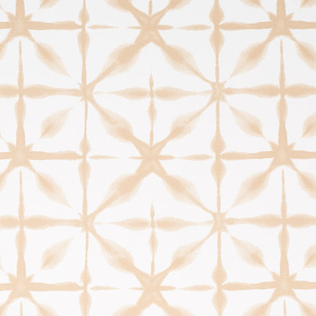 ANDROMEDA wallpaper in Sand by Schumacher, a shibori-inspired geometric pattern in soft beige tones, shown in a modern interior setting.