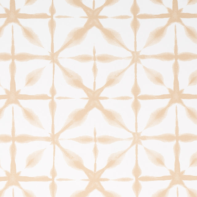 ANDROMEDA wallpaper in Sand by Schumacher, a shibori-inspired geometric pattern in soft beige tones, shown in a modern interior setting.